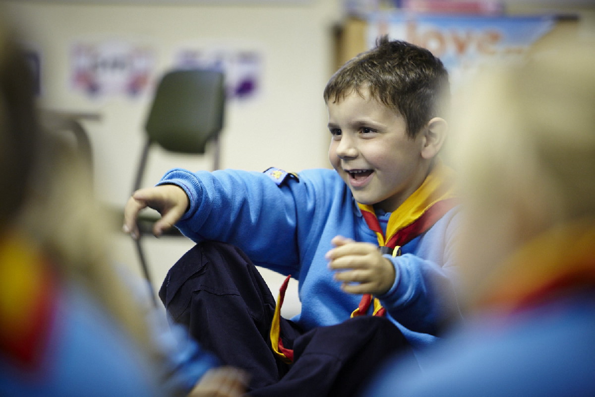 Image of a  Beacer pointing and smiling